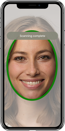 womans face on mobile phone taking a selfie with jumio scanning complete